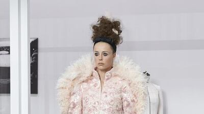 Karl Lagerfeld's bride wore a pink bustier and trousers fashioned from lace, tulle and satin, encrusted with strands of pink and white wool. Courtesy Chanel