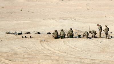 US soldiers take a break during their live-fire exercise. Chris Whiteoak / The National