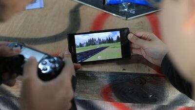 Visitors have a go at flight simulation. Ravindranath K / The National