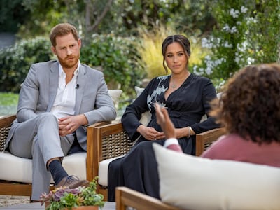 Britain's Prince Harry and Meghan, Duchess of Sussex, are interviewed by Oprah Winfrey in this undated handout photo. Reuters