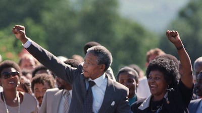 A picture taken on February 11, 1990 shows Nelson Mandela and his then-wife anti-apartheid campaigner Winnie raising their fists and saluting cheering crowd upon Mandela's release from the Victor Verster prison near Paarl. AFP