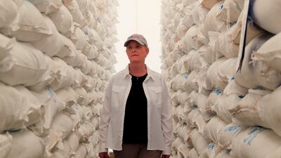Cindy McCain, US ambassador to the UN agencies in Rome, inspects bags of grains donated by USAID at the WFP warehouse. Reuters