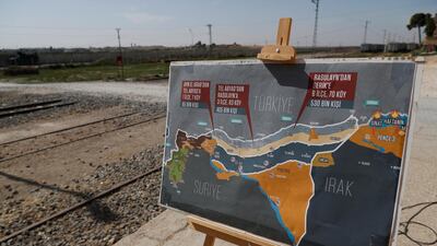 A map showing Turkey's suggested possible operation in Syria, used by a TV journalist, is seen at the border between Turkey and Syria, in Akcakale, Sanliurfa province, southeastern Turkey. AP Photo