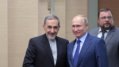 Russian President Vladimir Putin shakes hands with Ali Akbar Velayati, a top adviser to Iranian supreme leader Ayatollah Ali Khamenei, during a meeting outside Moscow on July 12, 2018. Kremlin via Reuters