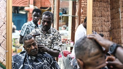 A Sudanese refugee gets a haircut in Cairo. More than a million people fled to Egypt after civil war broke out in Sudan last April 2023. EPA-EFE