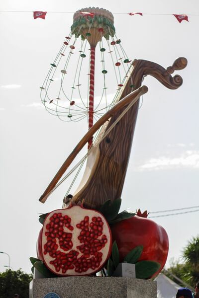 A pomegranate statue at the heart of Testour highlights the fruit's symbolism for the city's residents. Ghaya Ben Mbarek / The National