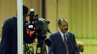 Eritrea's President Isaias Afwerki (C) addresses a crowd behind safety glass at an celebrational event for at Millennium Hall in Addis Ababa, Ethiopia. EPA