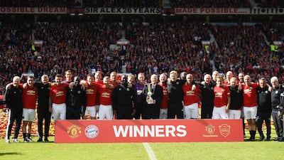 Manchester United 99 Legends hold the winners' trophy after beating Bayern Munich 5-0. Getty