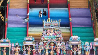 Devotees rest on stairs at a temple, during the Hindu festival of Diwali, amid the coronavirus disease (COVID-19) outbreak in Kuala Lumpur, Malaysia November 14, 2020. REUTERS/Lim Huey Teng TPX IMAGES OF THE DAY