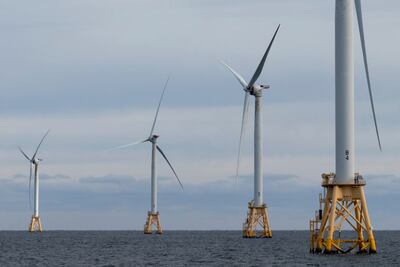 Renewable energy methods such as wind turbines require considerable natural resources. Photo: AP