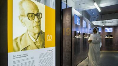 The Nobel Prize Exhibition at the Annex Burj Khalifa. A banner depicts Naguib Mahfouz, who was the first native Arab speaker to win the Nobel Price for Literature. Antonie Robertson / The National