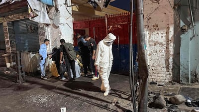 Police officials inspect the site of a suspected suicide bombing in Pakistan's Swat district on August 2. AFP