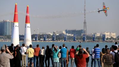 Crowds watch the qualifying rounds in this year's Red Bull Air Race World Championship on the breakwater in Abu Dhabi. Ravindranath K / The National