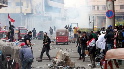 Iraqi protesters clash with anti-riot police forces at Al Rasheed street in central Baghdad. EPA