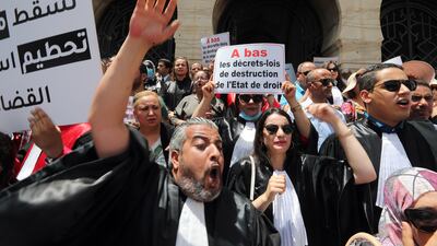 Tunisian judges outside the courthouse in Tunis protest against Kais Saied's June 1 decision to dismiss 57 magistrates. EPA