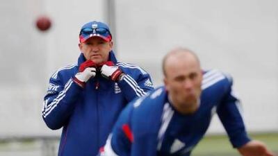 Andy Flower, left, watches Jonathan Trott bowl. The England coach will be monitoring the fitness of his bowlers after they had to toil hard on the final day to break through Australia's rearguard action. Sang Tan / AP Photo