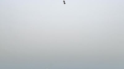 Franky Zapata (C) stands on his jet-powered "flyboard" as he takes off from Sangatte, northern France, attempting to fly across the 35-kilometre Channel crossing in 20 minutes, while keeping an average speed of 140 kilometres an hour at a height of 15-20 metres above the sea on July 25, 2019. AFP / Denis Charlet