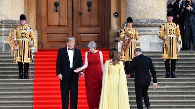 Theresa May and her husband Philip greet Donald Trump and his wife Melania at Blenheim Palace. Getty Images