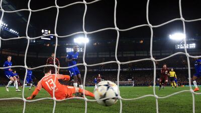 Barcelona's Lionel Messi, second right, celebrates scoring his side's first goal of the game during the Champions League tie with Chelsea at Stamford Bridge. Nick Potts/PA via AP