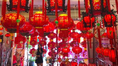A woman browses through Lunar New Year lanterns decorations at a shop in Kuala Lumpur, Malaysia. AP Photo