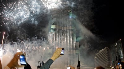 Spectators photograph the fireworks at Burj Khalifa on New Year's Eve on December 31, 2010. Jeff Topping / The National