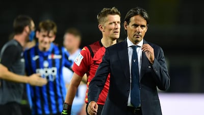 Lazio manager Simone Inzaghi leaves the pitch after the defeat to Atalanta. AFP