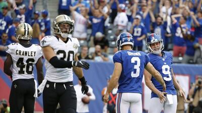 New York Giants 16 New Orleans Saints 13: Giants punter Brad Wing celebrates with kicker Josh Brown after the winning field goal. Kathy Willens / AP Photo