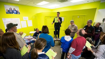 Joe Stuever, a volunteer for Democratic Kansas House candidate Sharice Davids, enlists volunteers to canvass for her at Davids' Johnson County Field Office in Overland Park, Kansas. EPA