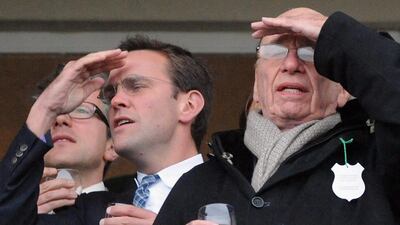 March 18, 2010: In this file photo showing James Murdoch, left, and Rupert Murdoch, right, during the Cheltenham Festival at Cheltenham, England. Rebekah Brooks has resigned Friday, July 15, 2011, as chief executive of Rupert Murdoch's embattled British n???