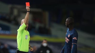 Arsenal's Nicolas Pepe is sent off for his contact with Leeds' Ezgjan Alioski. EPA