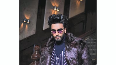 Singh added a fur coat to a striped suit for extra panache on in February 2019. Instagram / Ranveer Singh