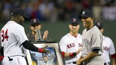 Mariano Rivera, right, received a big hug from David Ortiz before the game on Saturday. Gretchen Ertl / Reuters