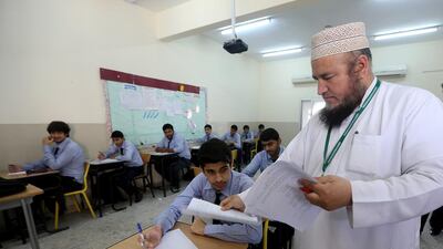 Students hard at work during class at the Pakistan Education Academy in Dubai. Satish Kumar / The National