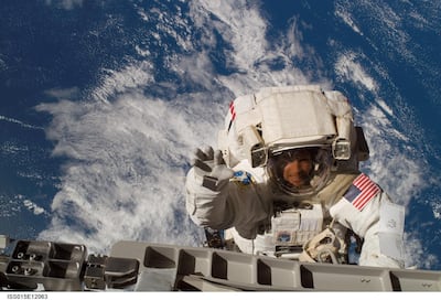 An astronaut wearing Nasa's Extravehicular Mobility Unit carries out repairs in space. Courtesy: Nasa