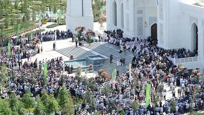 People gather outside a new mosque.