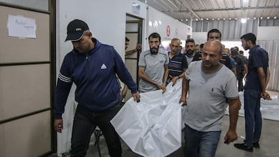 The bodies of those killed during an Israeli strike on a camp for displaced Palestinians have been taken to the Tal Al Sultan clinic in Rafah. Bloomberg