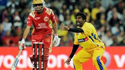 Muttiah Muralitharan, right, of Chennai Super Kings appeals unsuccessfully during the IPL semi-final match against Bangalore.