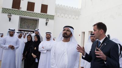 Sheikh Mohammed bin Rashid, Vice President and Ruler of Dubai, listens to Mark Powell Kyffin, head of architecture at ADTCA, right, during a tour of Qasr Al Hosn fort. With him are Sheikh Hamdan bin Mohamed, Crown Prince of Dubai, back left, Sheikha Lubna Al Qasimi, Minister of Development and International Co-operation (back second left), Sheikh Hamdan bin Zayed, Deputy Prime Minister and Ruler of the Western Region, back fourth left, and others. Mohamed Al Hammadi / Crown Prince Court - Abu Dhabi