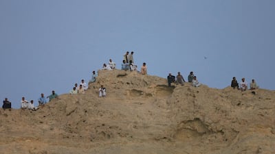 Fans attend the match. EPA