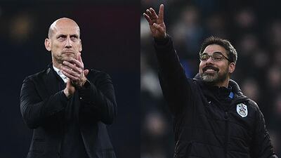 Reading's Dutch manager Jaap Stam, left, and Huddersfield Town's German manager David Wagner will hope to guide their respective teams to the Premier League when they meet in the Championship play-off final at Wembley Stadium on Monday, May 29, 2017. Oli Scarff / AFP