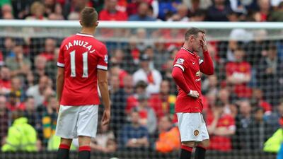 Adnan Januzaj and Wayne Rooney look dejected during Manchester United's loss to Swansea. Alex Livesey / Getty Images