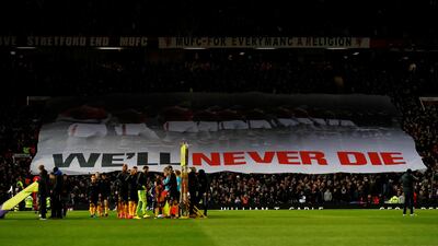 General view as Manchester United fans display a banner to mark the anniversary of the Munich air disaster before the match against Wolves at Old Trafford. Reuters