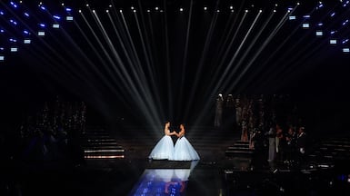 Miss Tahiti Hinaupoko Deveze and Miss Nouvelle-Caledonie Juliette Collet await the result on stage of the Miss France 2026 beauty pageant at the Zenith, in Amiens, northern France. AFP