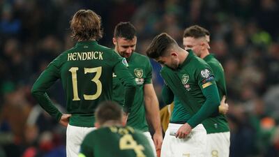 Republic of Ireland players Sean Maguire, Jeff Hendrick and teammates look dejected after the match. Reuters