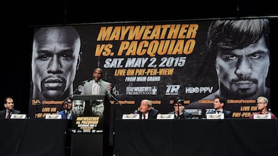 Boxer Floyd Mayweather speaks at the podium on Wednesday during the press conference for his May 2 fight with Manny Pacquiao. Frederic J Brown / AFP