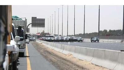 Police set up a detour yesterday after a reservoir flooded a section of Emirates Road.