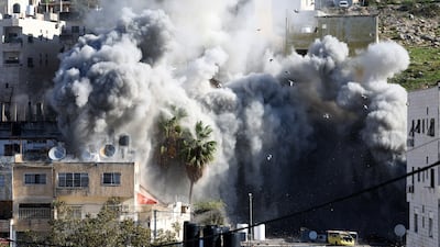 Soldiers forced families to leave 13 nearby homes before the demolition