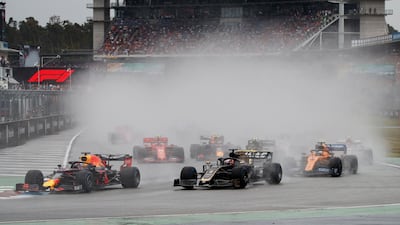 Verstappen leads in the wet on his way to victory. EPA