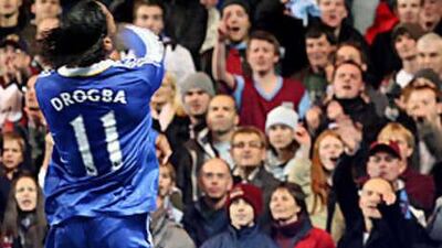 Didier Drogba throws an object back into the crowd during Chelsea's Carling Cup tie against Burnley.
