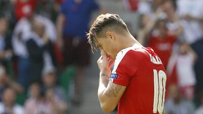 Switzerland's Granit Xhaka reacts after missing during the penalty shootout in his team's last 16 loss to Poland at Euro 2016 on Saturday. Yves Herman / Reuters / June 25, 2016